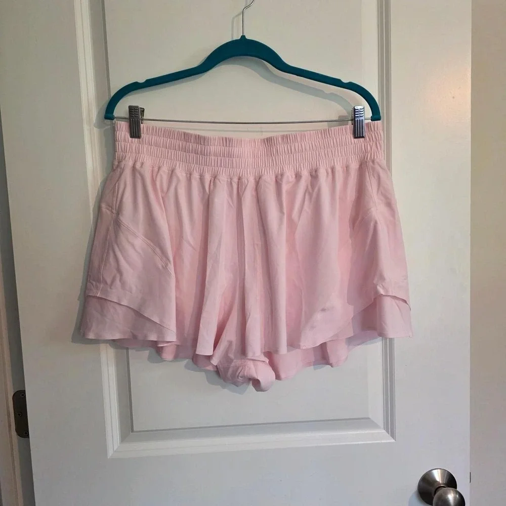 Lululemon Shake It Out High Rise Run Shorts in light baby pink pearl color